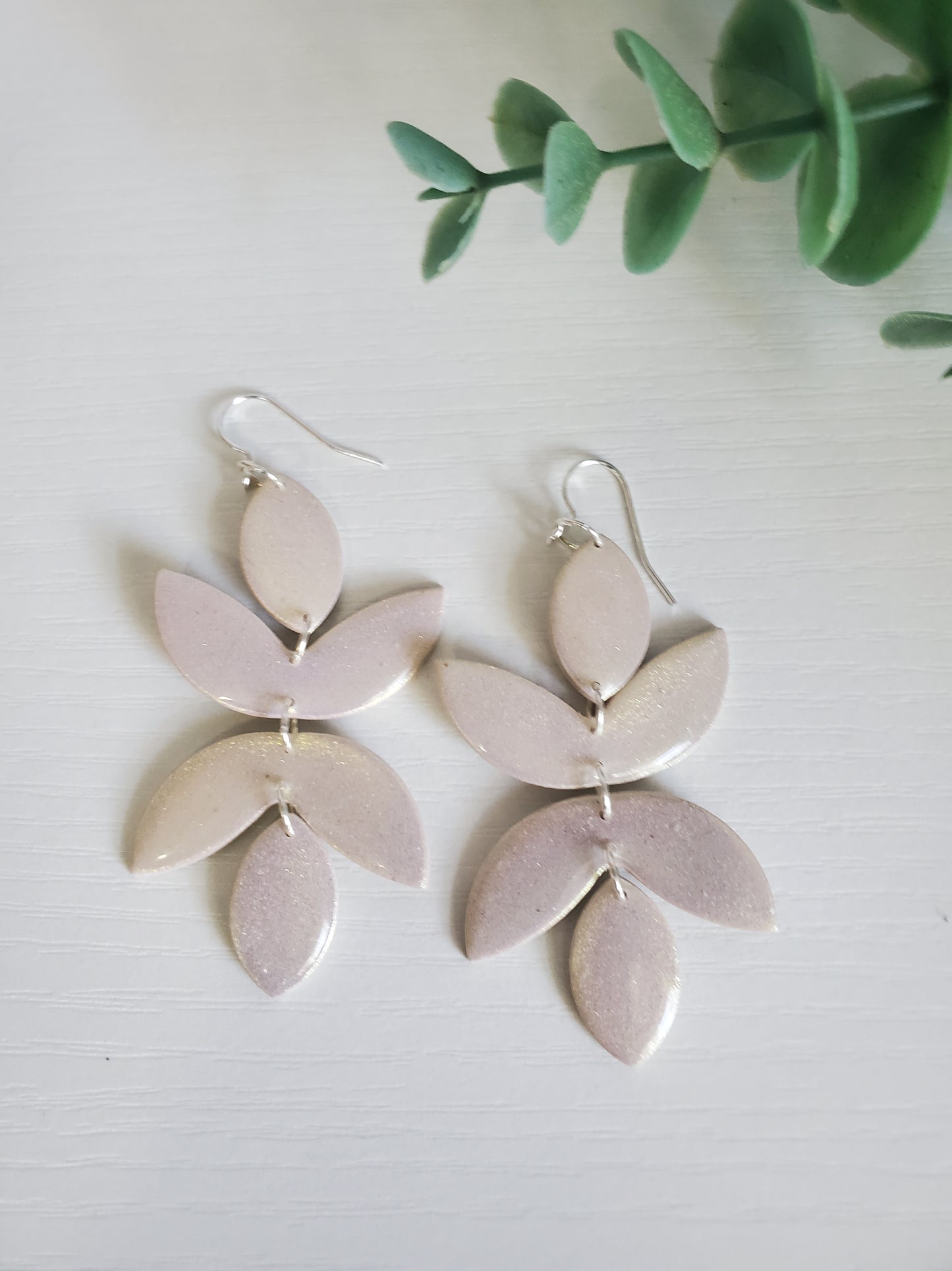 Cara in shimmering off white